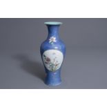 A Chinese famille rose blue ground baluster vase, Qianlong mark, 19th C.