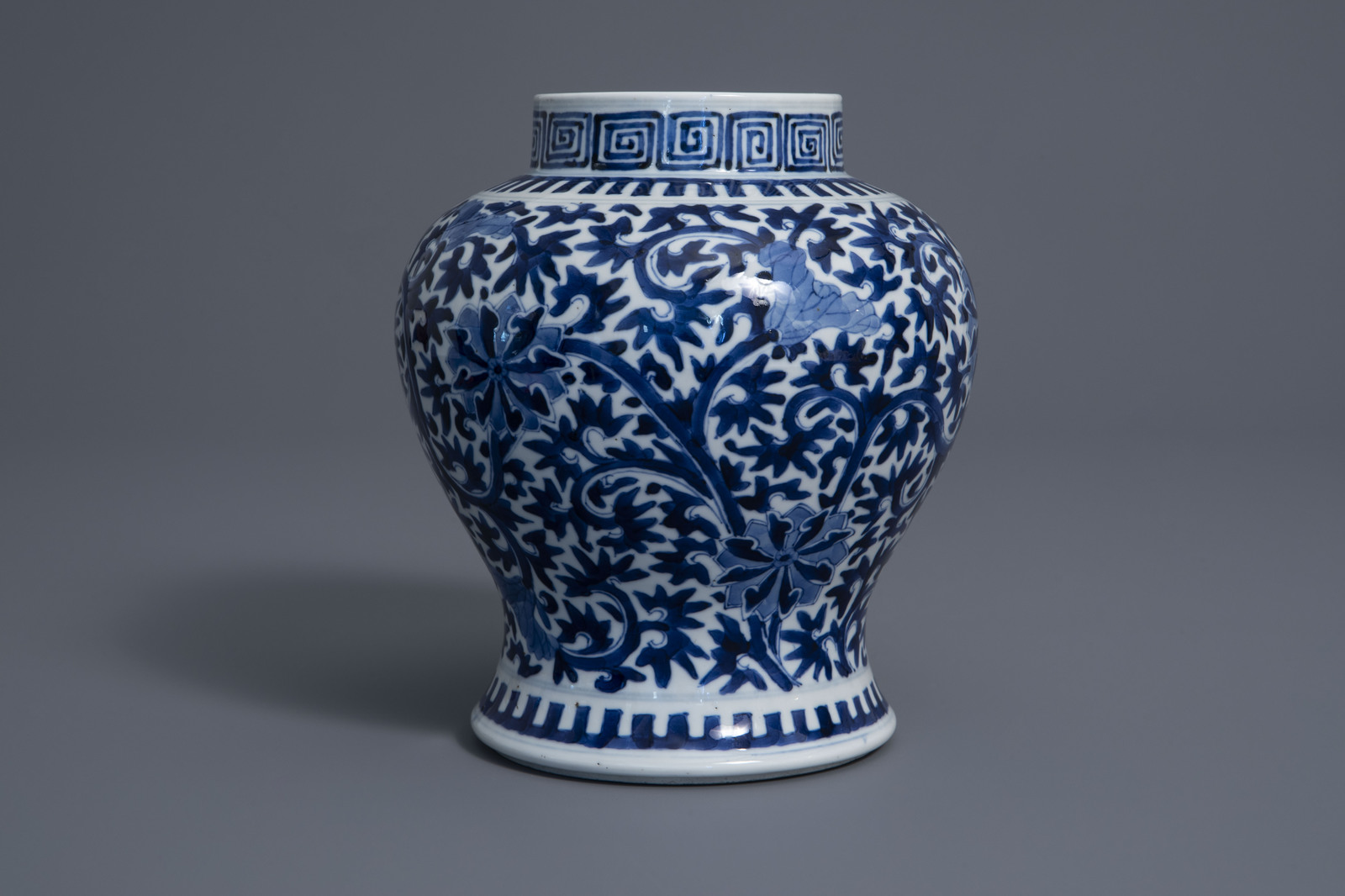 A Chinese blue and white baluster vase with floral design, Kangxi mark, 19th C. - Image 4 of 7