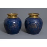 A pair of ormolu mounted Chinese gilt decorated powder blue ground jars, 19th/20th C.