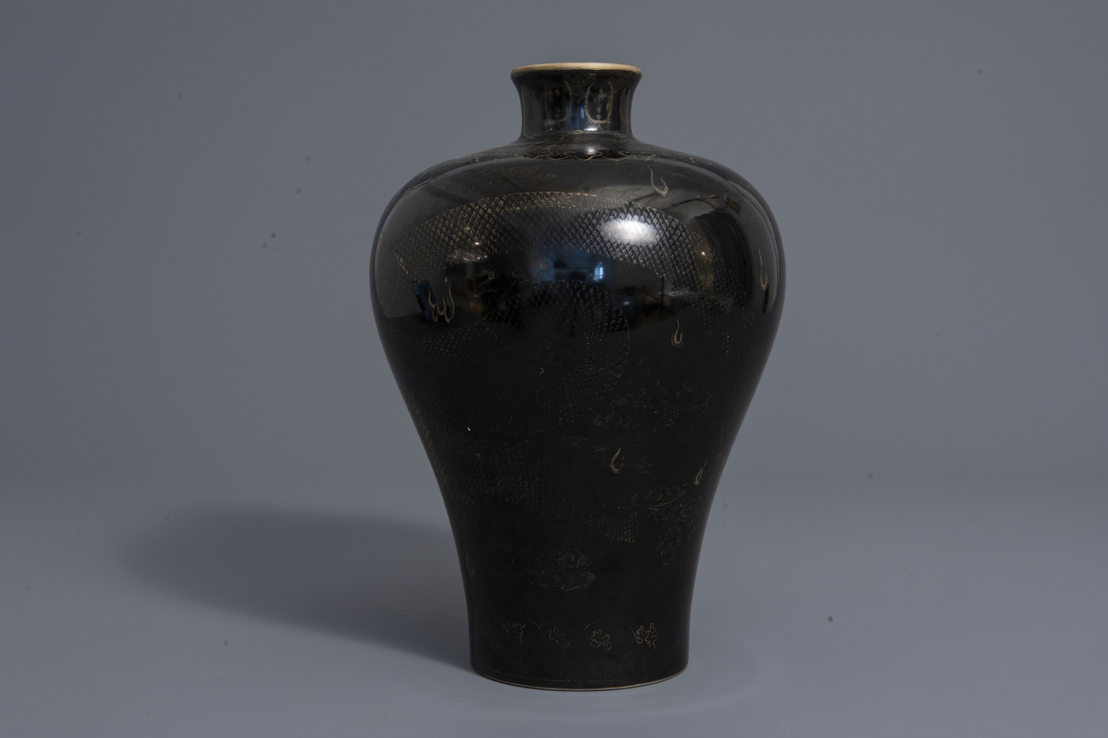 A Chinese black ground vase with a gilt dragon chasing the pearl, Qianlong mark, 19th C. - Image 5 of 7