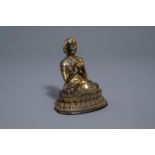 A gilt bronze figure of a Lama, Tibet, 16th/17th C.