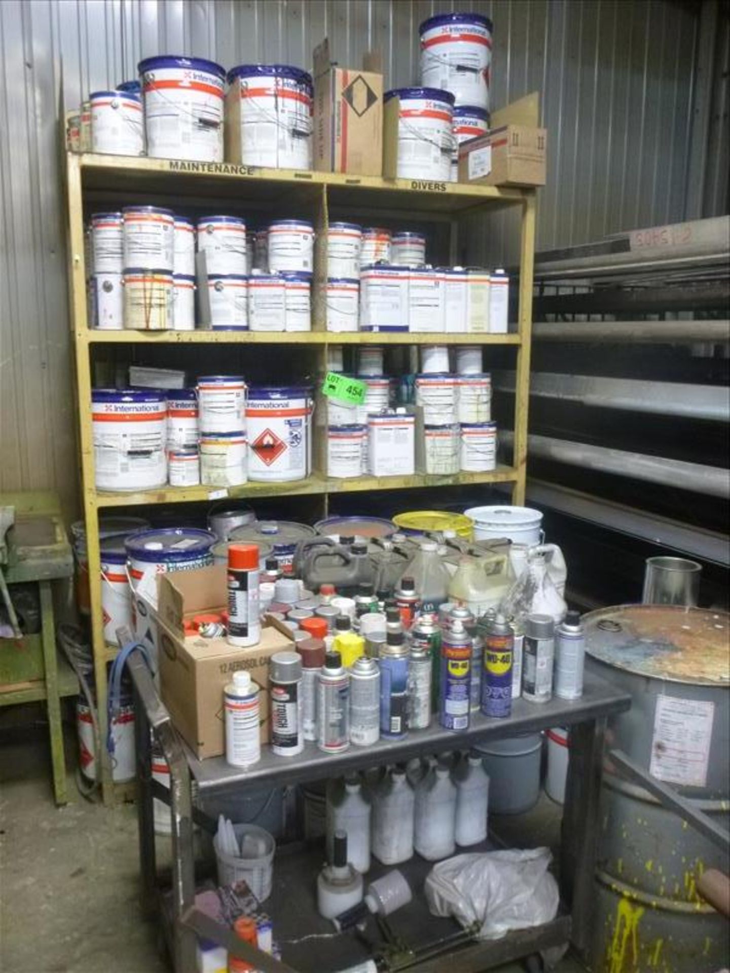 rack c/w contents; paints, thinners, etc. (located at 164 Rue Strathcona)