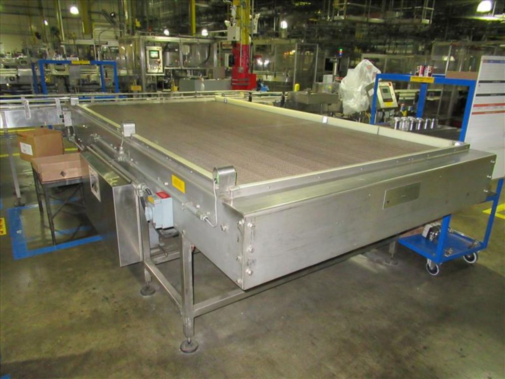 B and T packaging Accumulation table approx 6 ft. W x 12 ft. L, with 24 in. W x 10 ft. transfer from