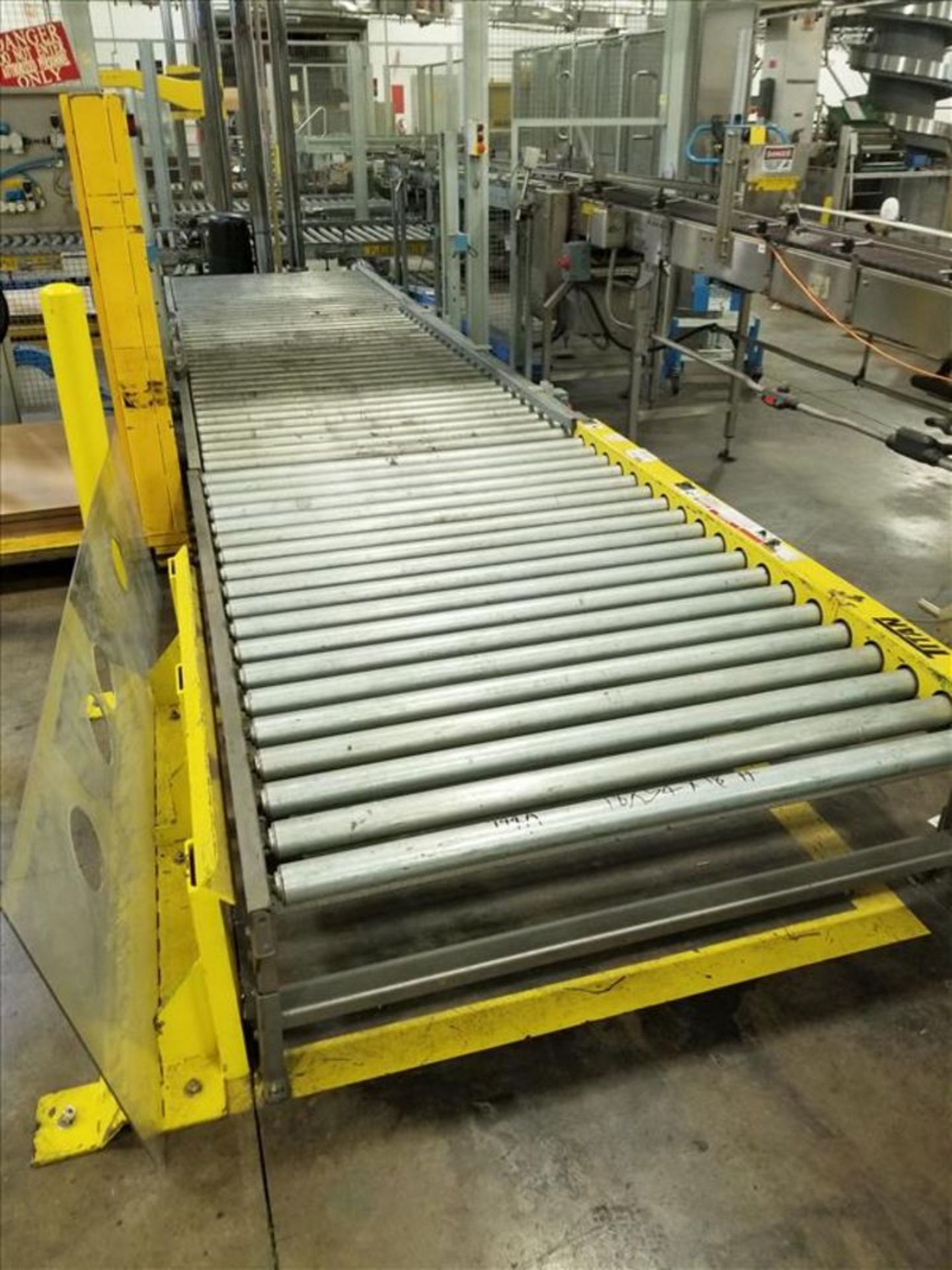 (2) Titan pallet roller infeeds approx 54 in. W x 18 ft. L x 18 in. h feed robot 3 and robot 1 [