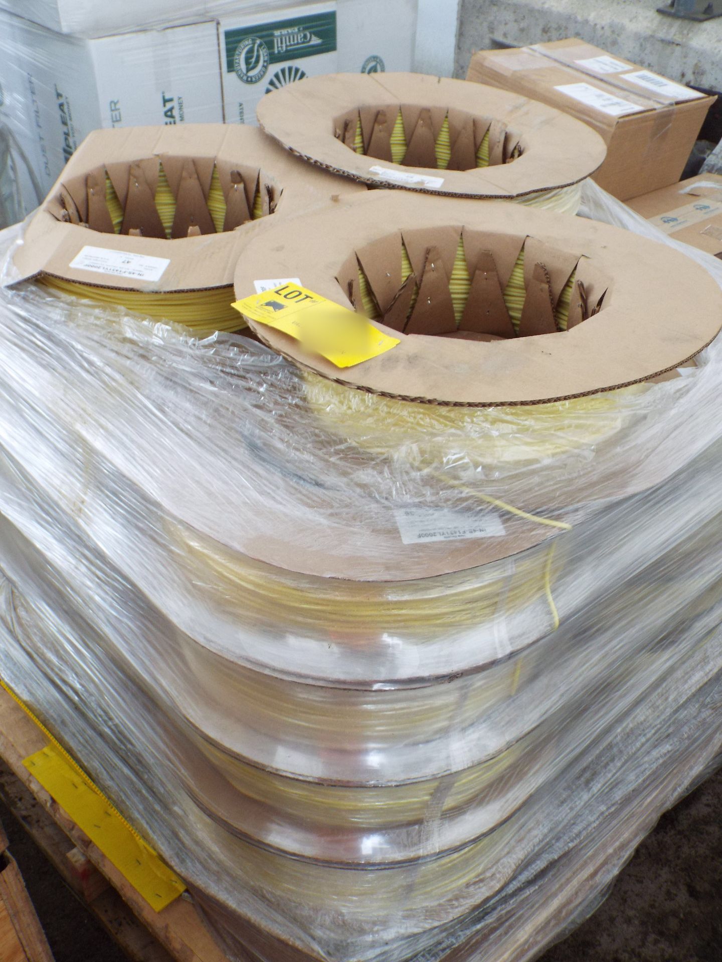 LOT/ CONTENTS OF SKID - (APPROX. 19) 2000 FT. SPOOLS OF SPLINE YELLOW TUBING (PLT 115)