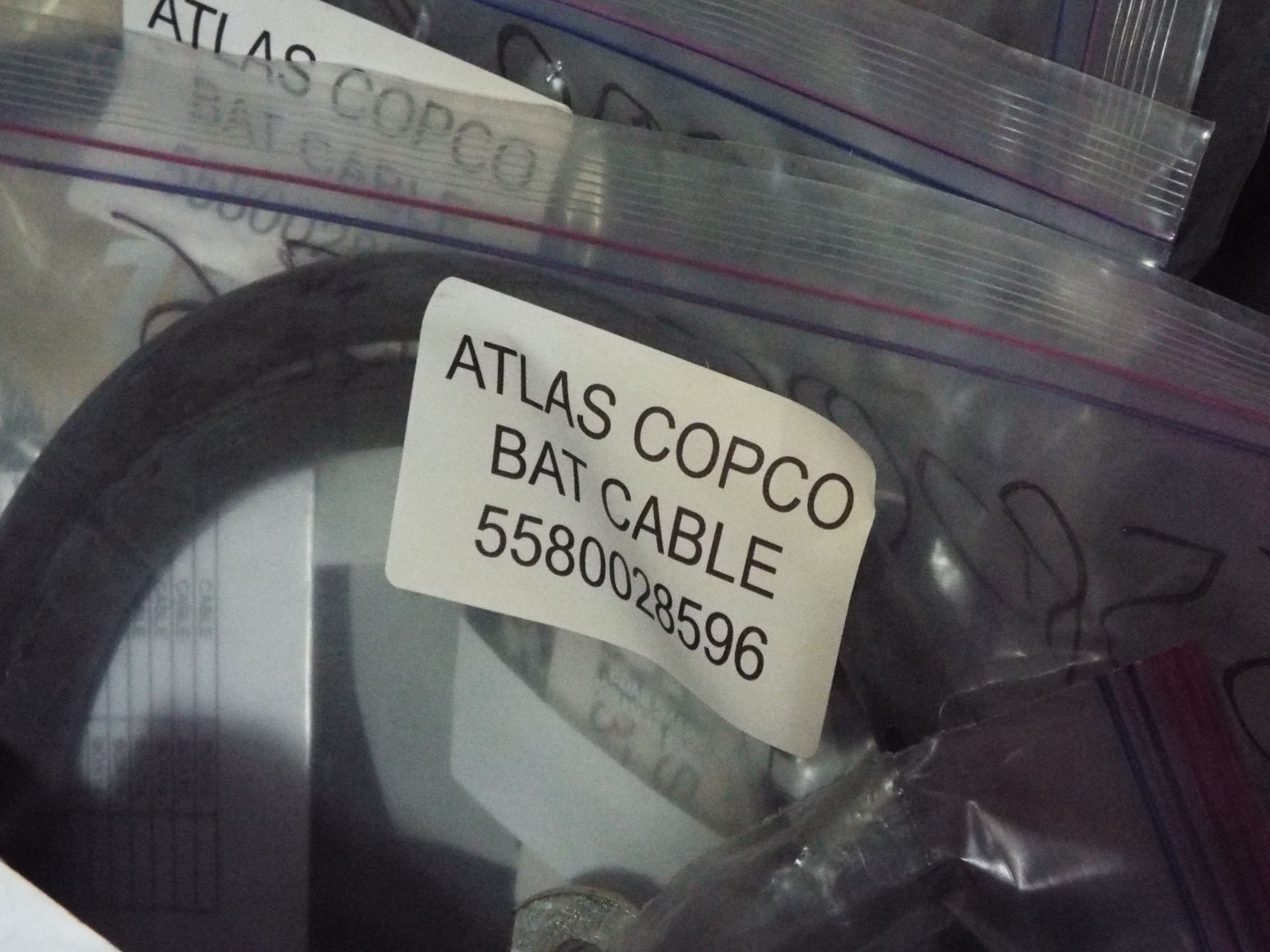 LOT/ ATLAS COPCO PARTS INCLUDING BUSHING STEEL, CONE, BAT CABLE, AND OTHER CABLES/HARNESSES - Image 10 of 16