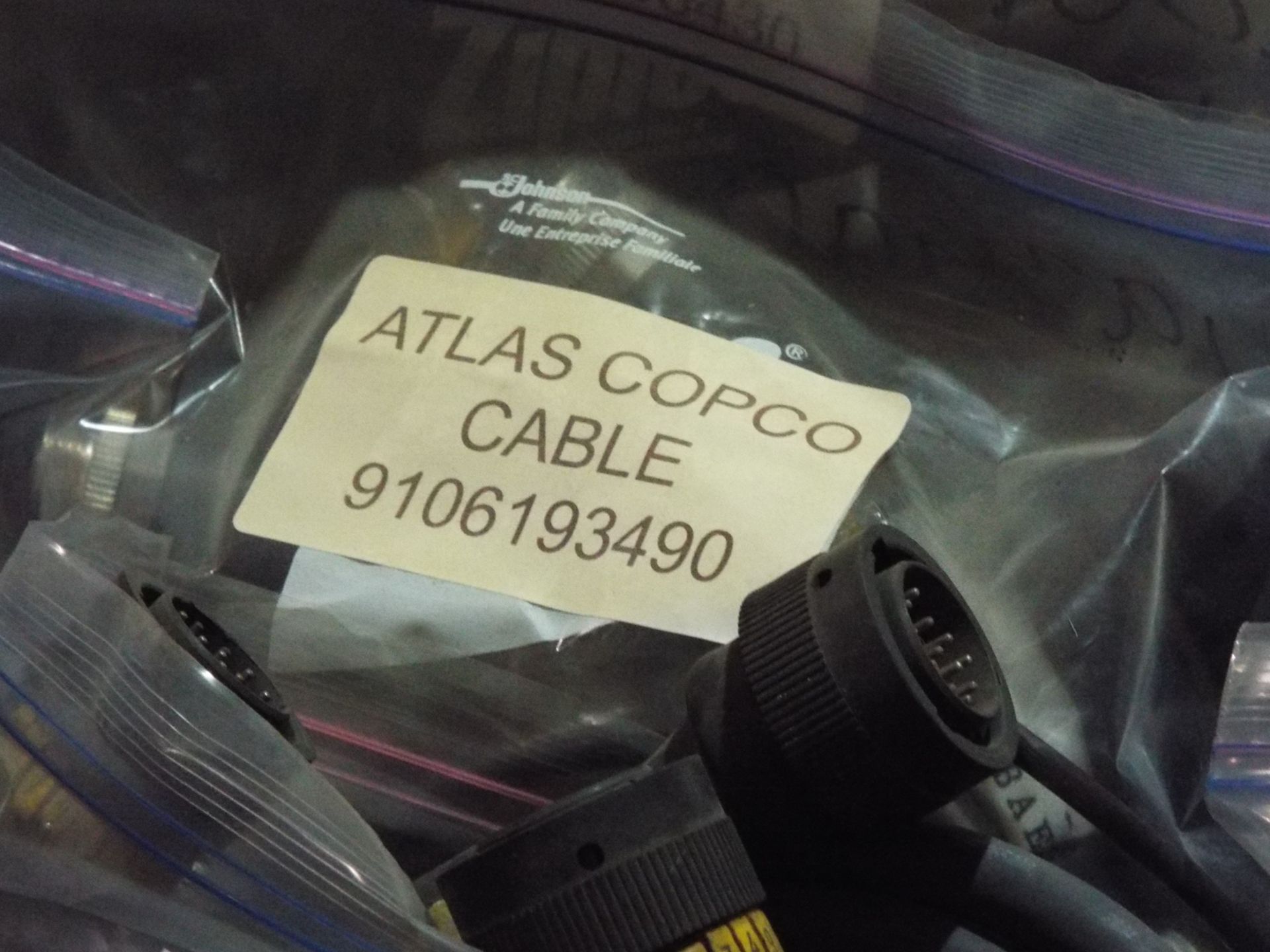 LOT/ ATLAS COPCO PARTS INCLUDING BUSHING STEEL, CONE, BAT CABLE, AND OTHER CABLES/HARNESSES - Image 13 of 16