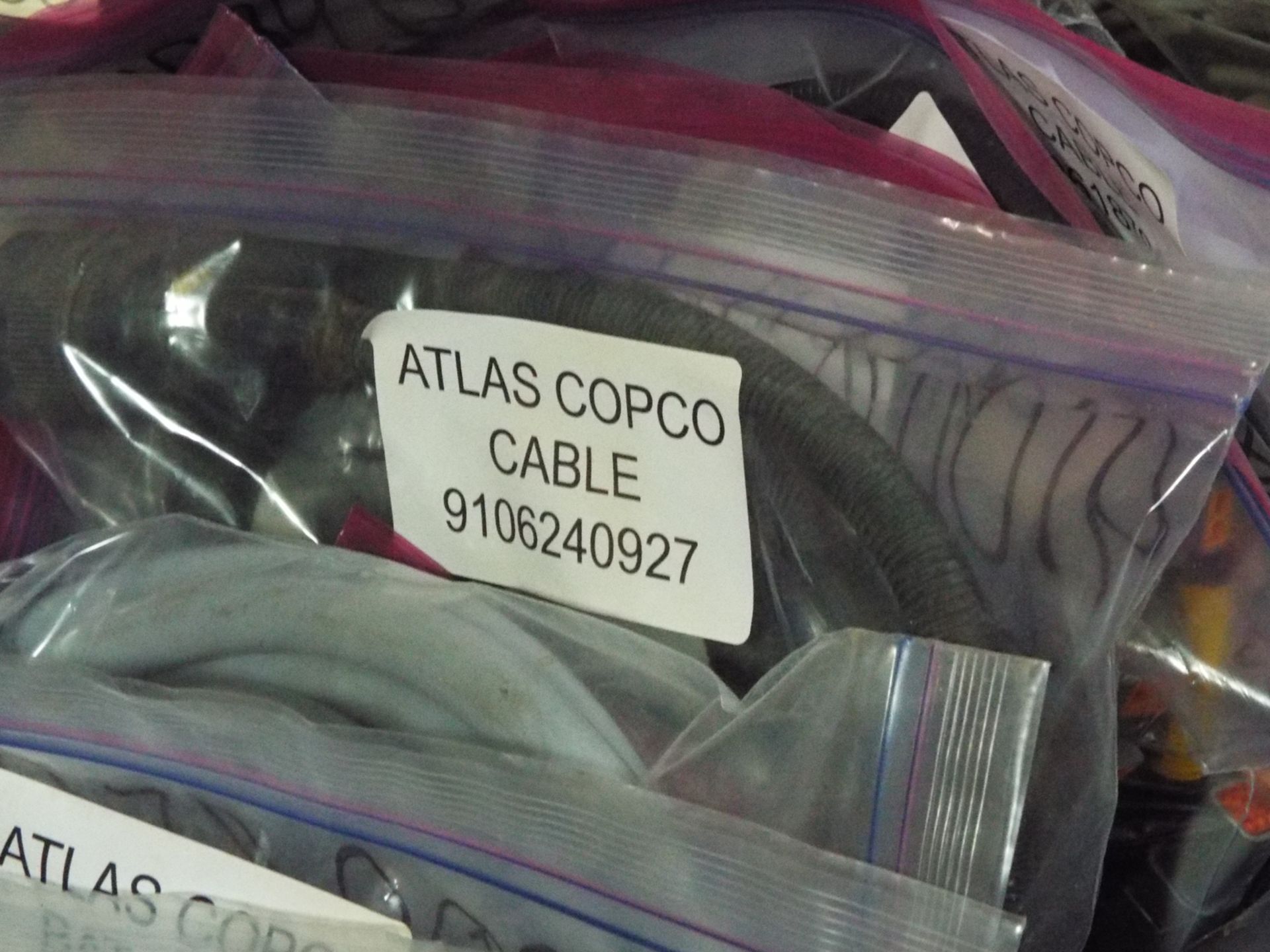LOT/ ATLAS COPCO PARTS INCLUDING BUSHING STEEL, CONE, BAT CABLE, AND OTHER CABLES/HARNESSES - Image 11 of 16