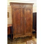 French fruitwood armoire with cavetto cornice, stylised floral carved frieze, the pair framed