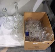 Four decanters, assorted glassware and decanter stoppers