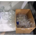 Four decanters, assorted glassware and decanter stoppers