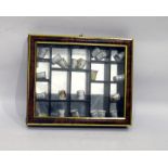 Collection of porcelain 'Coronation Street' thimbles in display case