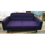 Three-seat settee of modern design, upholstered in a purple buttoned fabric