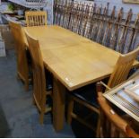 Modern beech dining table and a set of four chairs