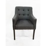 Button upholstered tub chair on ebonised supports, with loose cushion