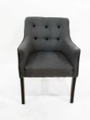 Button upholstered tub chair on ebonised supports, with loose cushion