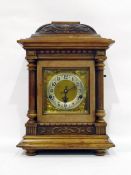 Late 19th century carved walnut cased German mantel clock with silvered chapter ring, striking and