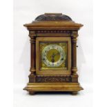 Late 19th century carved walnut cased German mantel clock with silvered chapter ring, striking and