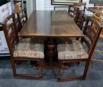 Oak refectory style dining table, the rectangular top with turned pedestal supports united by