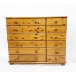 Pair of contemporary pine three-drawer bedside chests raised on bun feet and a pine chest of six