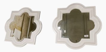 Pair of white moulded and shaped bevelled plate wall mirrors (2)