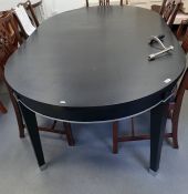 Contemporary black lacquer dining table with rounded ends, on square tapering legs, with two extra