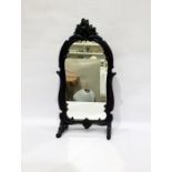 Early 20th Century dressing table mirror with shaped frame surmounted by carved floral spray