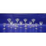 Assorted wines and sherry glasses etched with grapes on vine decoration