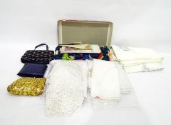 Two lady's evening bags, assorted embroidered tablecloths and a box of embroidery wool