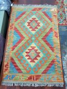 Small Cheli kelim rug with geometric lozenges on a blue field, geometric border, 92 x 58cm