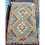 Small Cheli kelim rug with geometric lozenges on a blue field, geometric border, 92 x 58cm