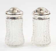 Pair of cut glass and silver-mounted sugar shakers, Birmingham 1904/5, maker's mark 'AG', 12cm high,