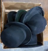 Six bowler hats and perspex stands, including examples by Hope Brothers