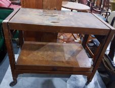 Walnut veneered two-tier tea trolley and a small child's painted metal rocking horse (2)