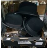 Five bowler hats and stands to include examples by Moores, Christys London