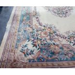 Large Chinese superwash cream ground carpet, the central stepped foliate decorated medallion on a