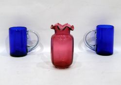 Two blue glass mugs with clear glass handles and a pink glass vase (3)