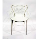 A Kartell Masters designer white plastic moulded tub chair