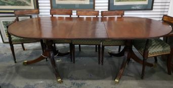 Georgian style mahogany twin-pedestal dining table with rounded ends and reeded border, on turned