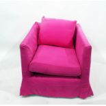 A square backed upholstered easy chair with loose squab cushion