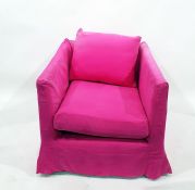 A square backed upholstered easy chair with loose squab cushion