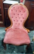 Lady's Victorian walnut framed deep button upholstered spoon back chair on cabriole supports