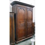 19th century French oak armoire with straight moulded pediment, the pair of scroll carved panel