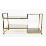 LOT WITHDRAWN Contemporary brass-framed and smoky glass four-wheeled serving/display table