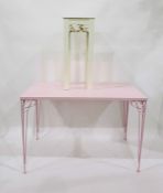 Pink painted rectangular top conservatory table with iron supports, length 110cm and a painted plant