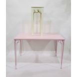 Pink painted rectangular top conservatory table with iron supports, length 110cm and a painted plant