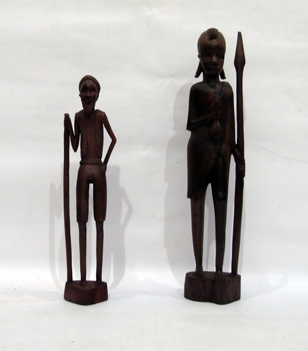 Two carved hardwood African figures holding spears