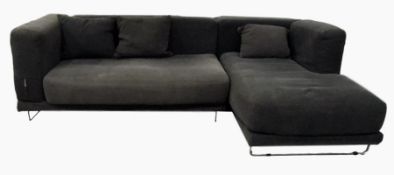 Modern L-shaped sofa with chromed steel frame, in two sections, with loose squab cushions and