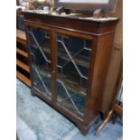 Mahogany Chippendale style glazed bookcase with dentil cornice, the astragal-glazed doors