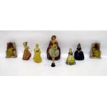 Six plaster figures of ladies in traditional dress and a pair of Egyptian-style bookends (8)